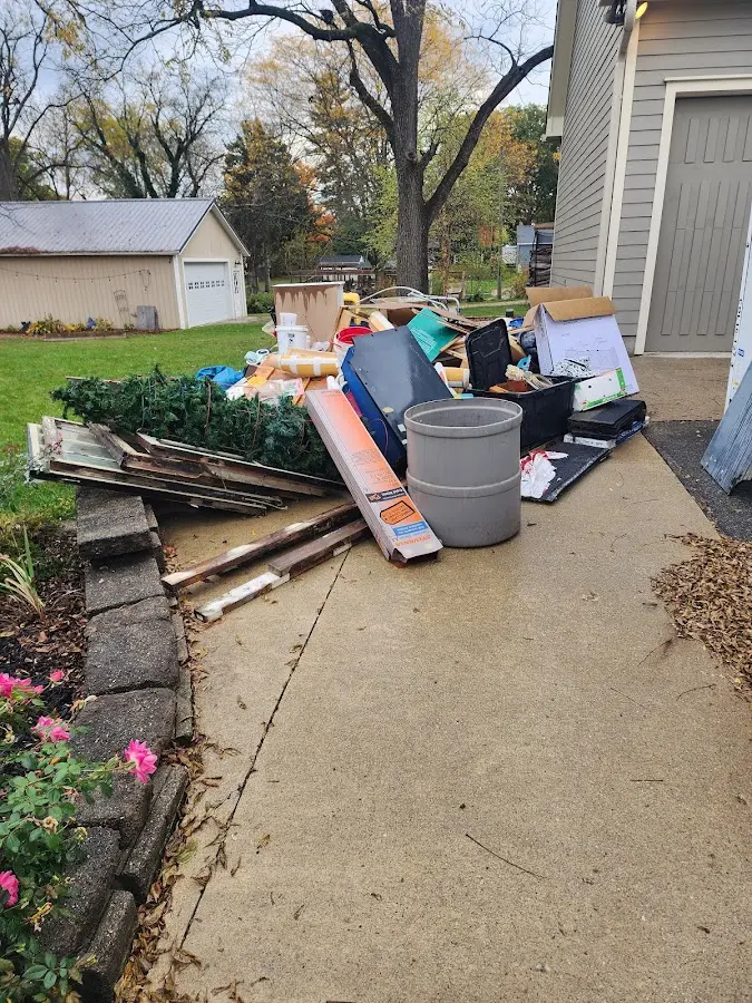 Dumpster being loaded with debris for Residential Dumpster Rental in Richmond